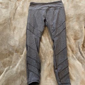 3/4 length leggings. Never worn. Size medium. Cute teal lining.